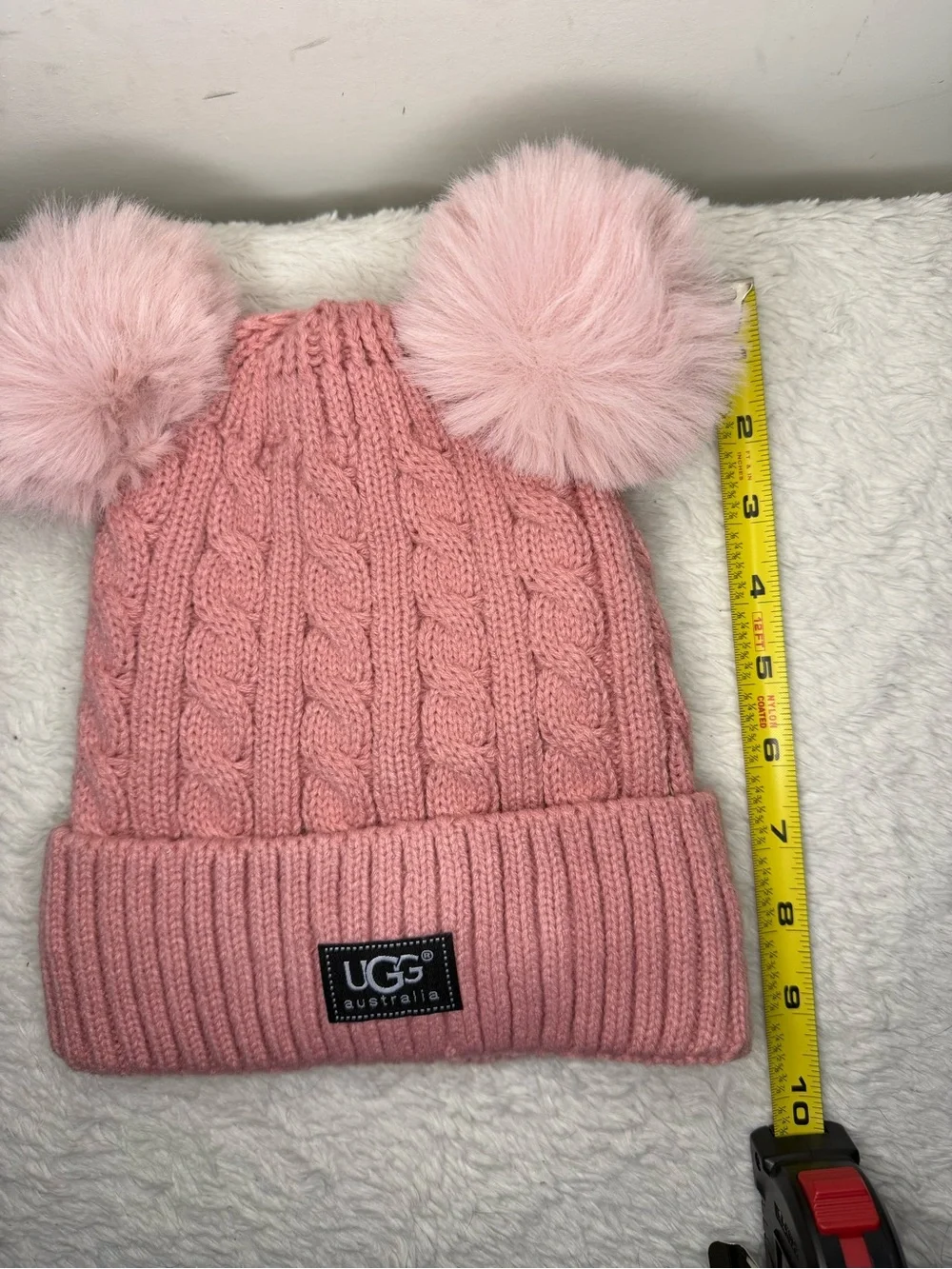 UGG Kids Blush Pink Cable Knit Hat with Dual Faux-Fur Poms